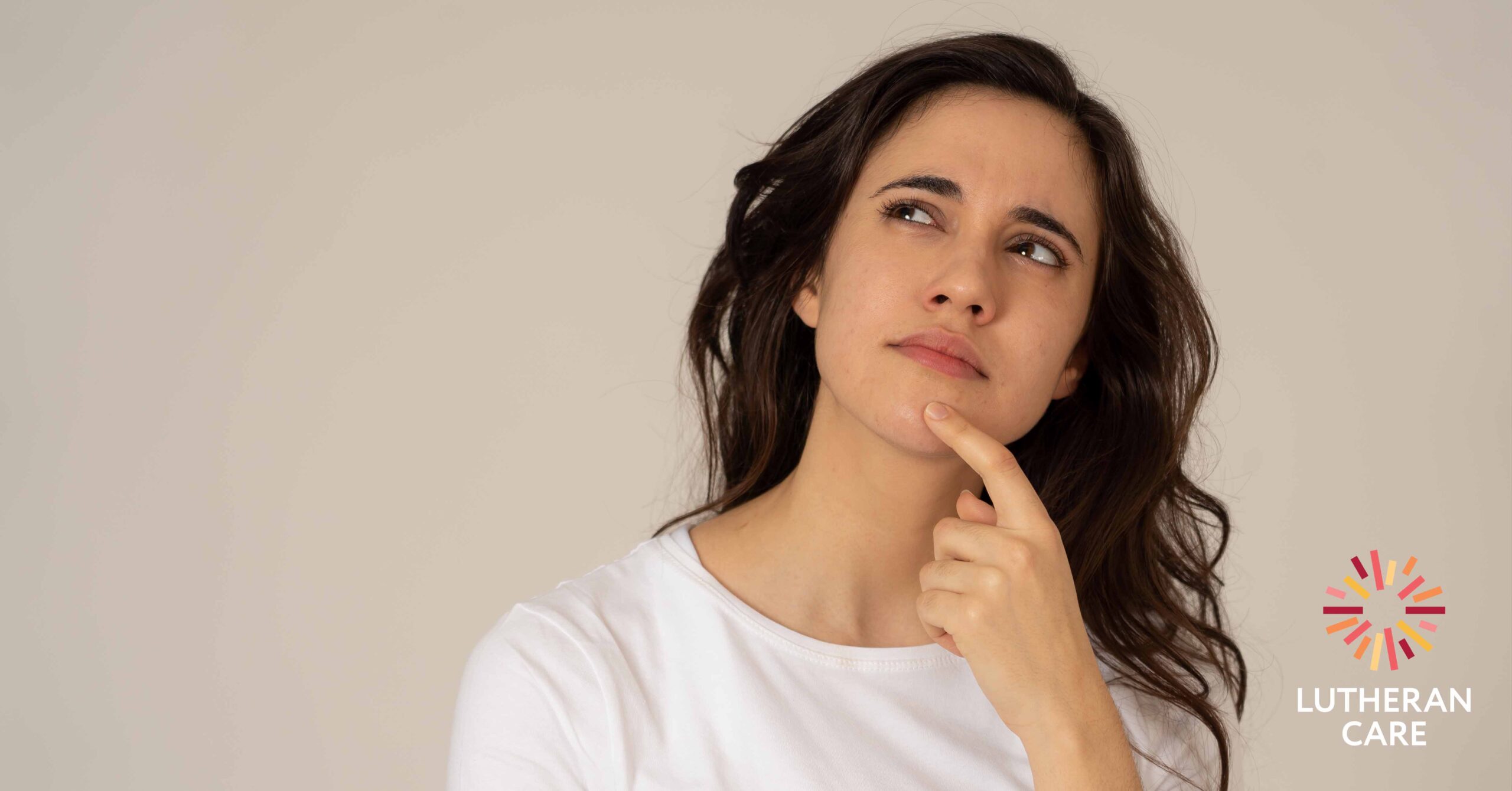 Woman who is thinking. The Lutheran Care logo appears in the bottom hand corner.