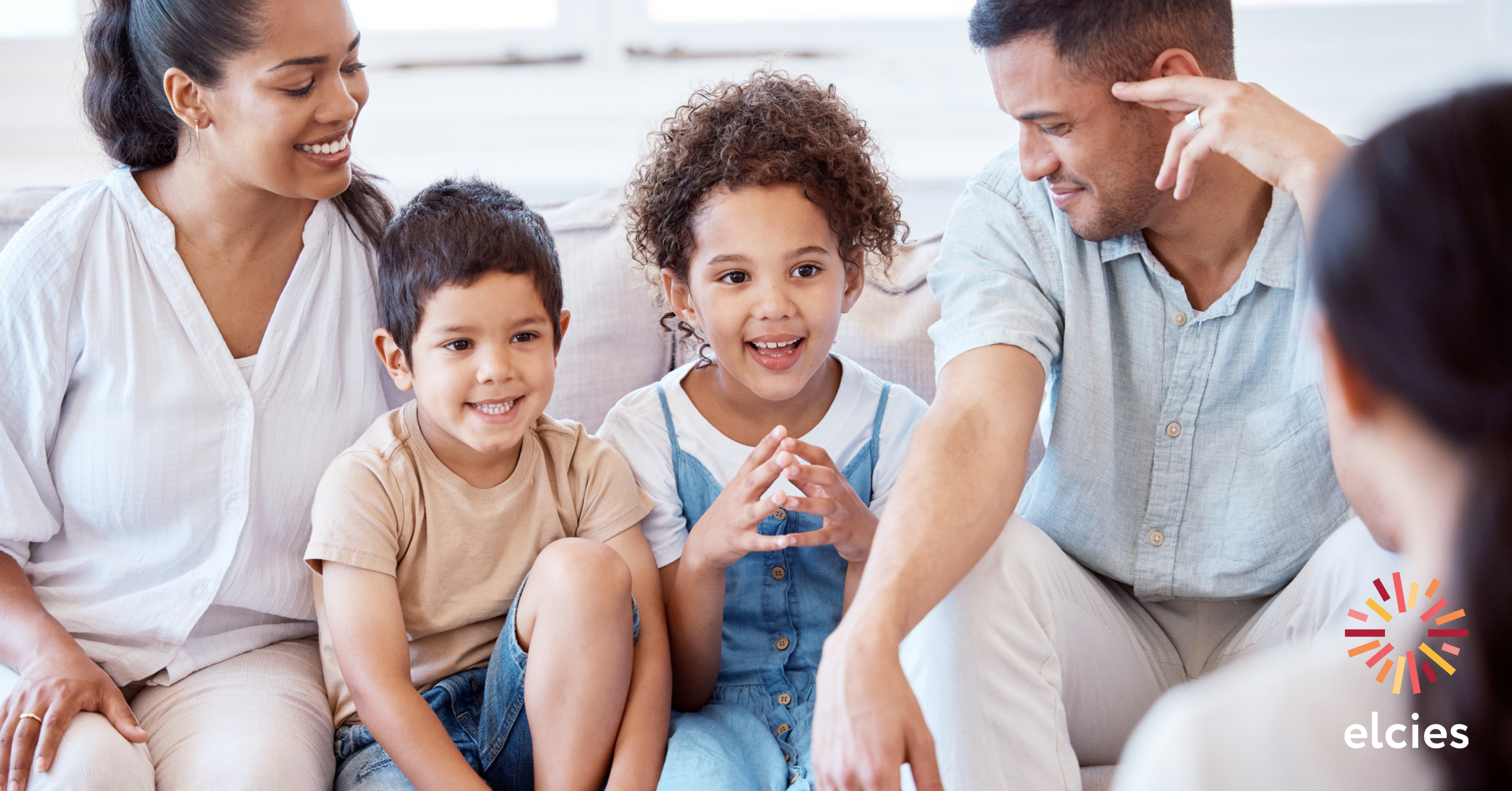 Parents and their two children sit with a speech pathologist in a session. The Elcies logo appears in the bottom right hand corner.