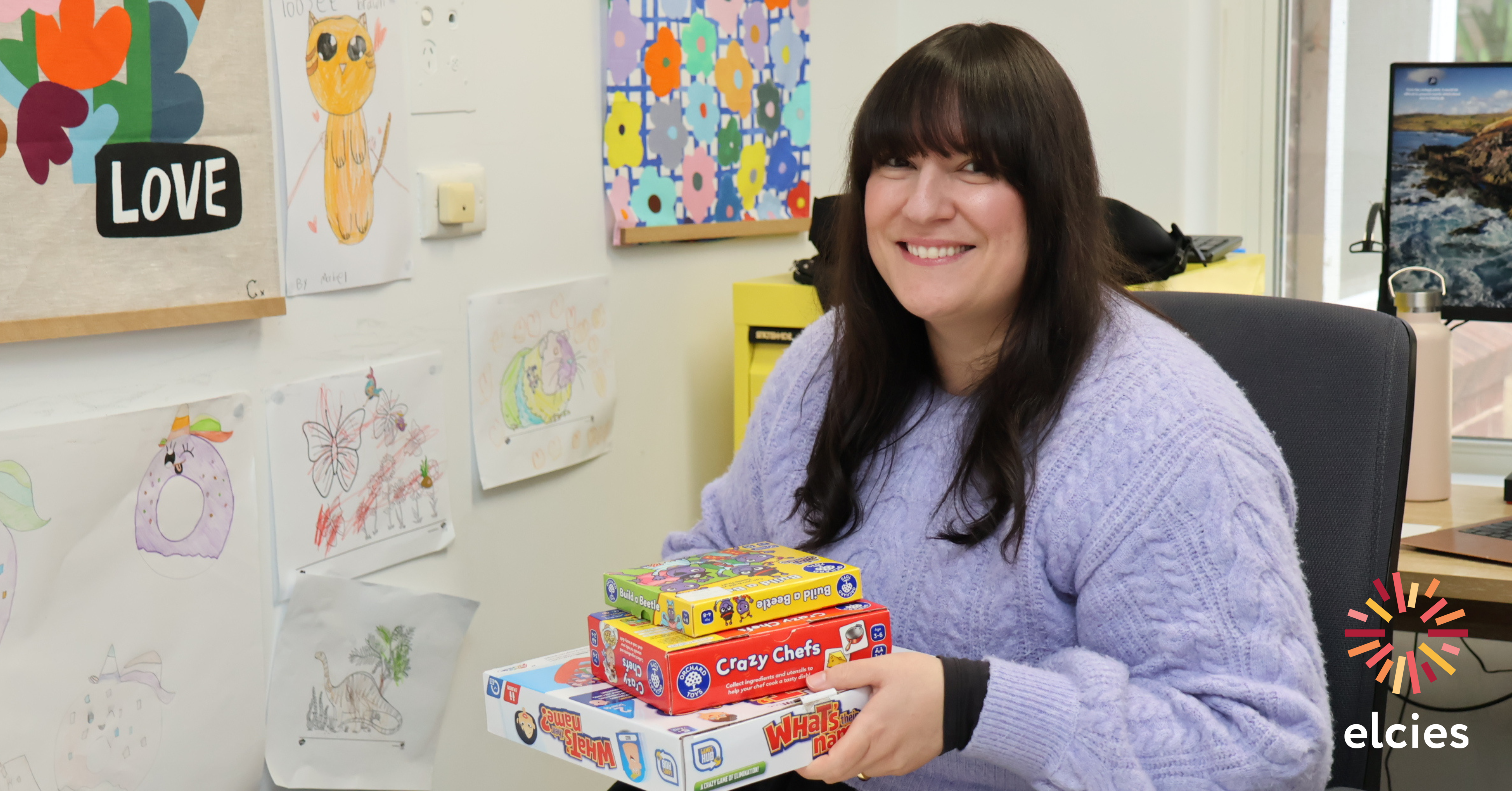 Image of Speech Pathologist Anna in the office. The Elcies logo appears in the lower right hand side.